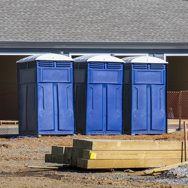 what is the cost difference between standard and deluxe porta potty rentals in Flambeau